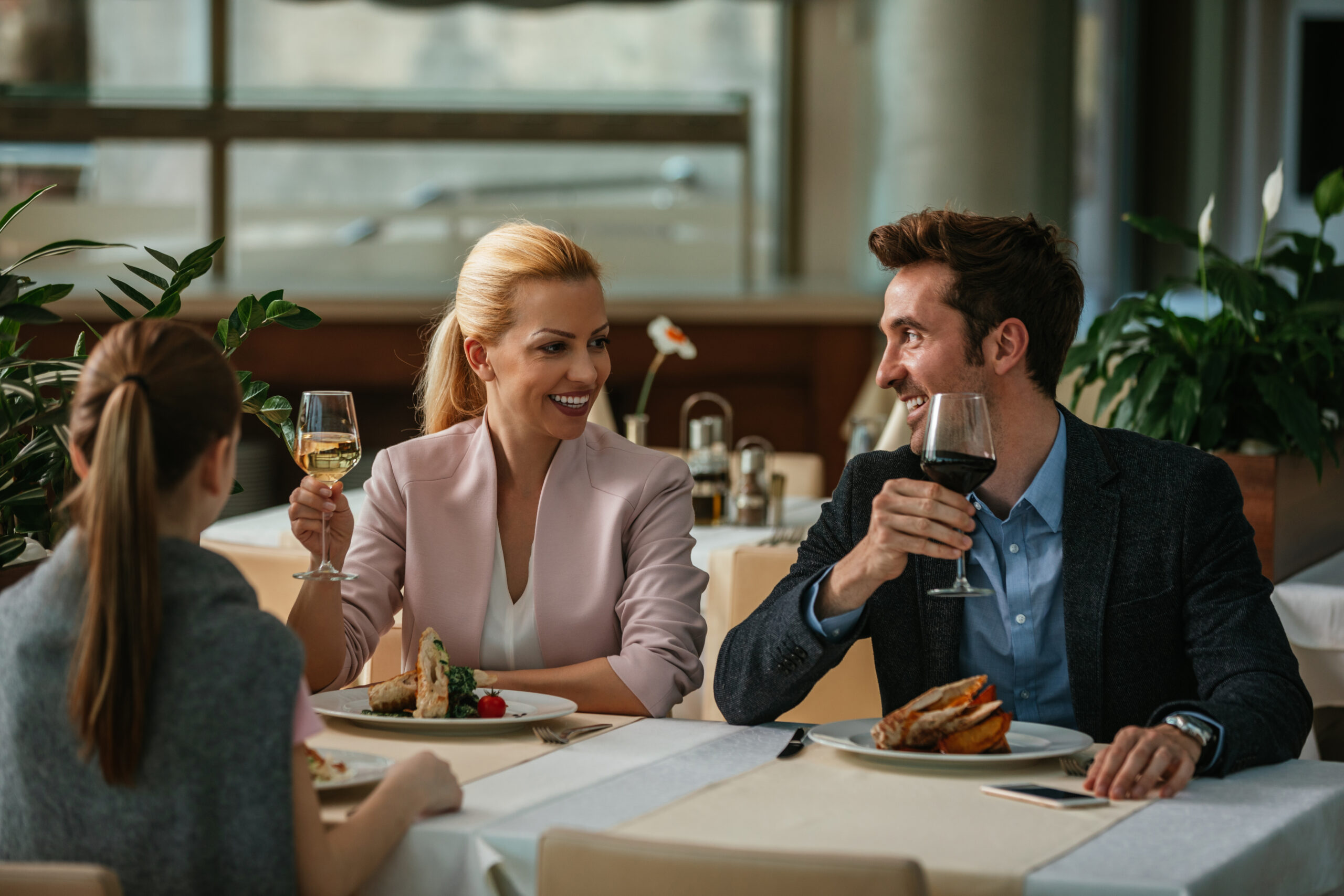 Happy family having lunch in a restaurant