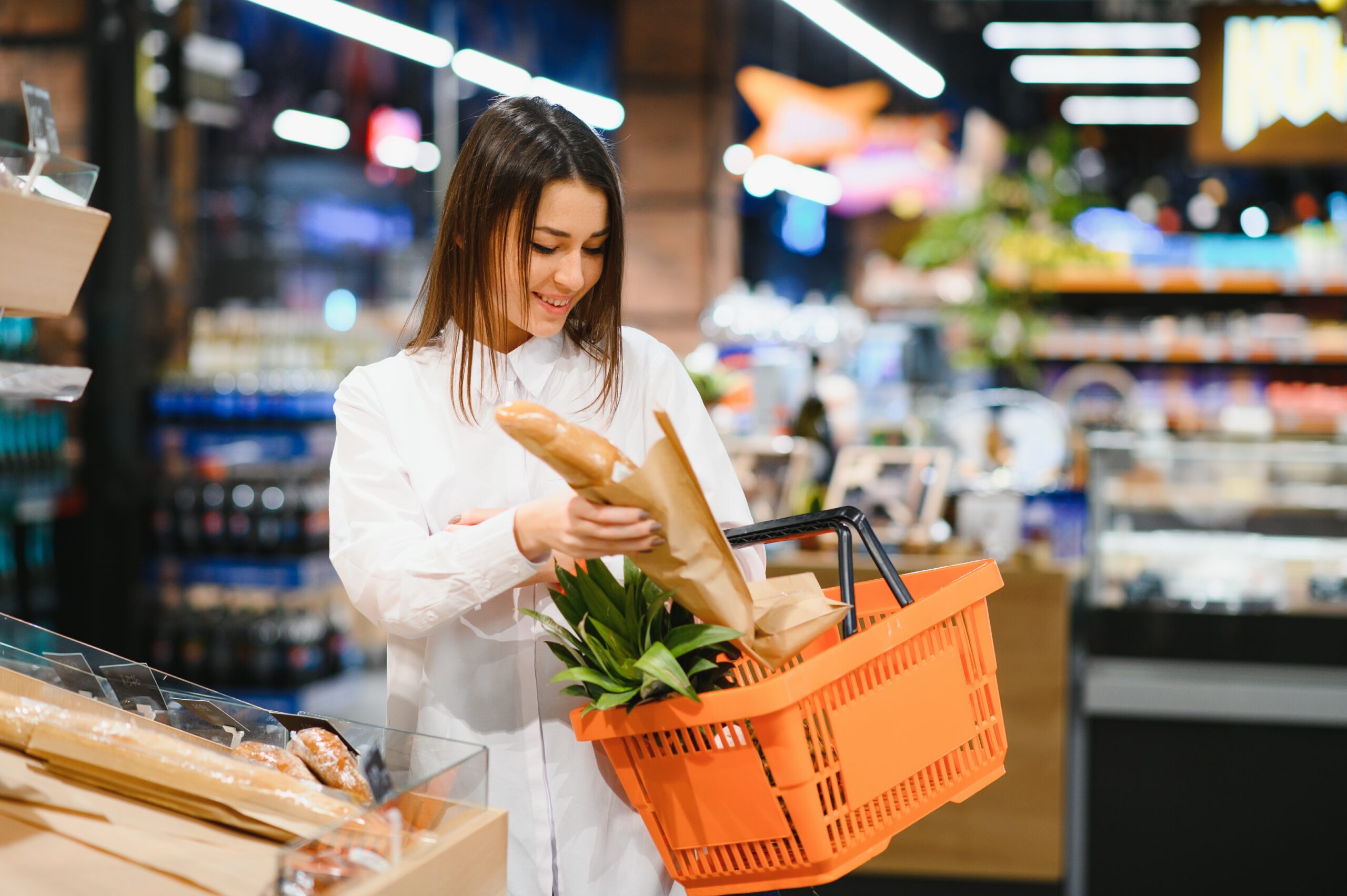 Woman holding a shopping bag of fresh food